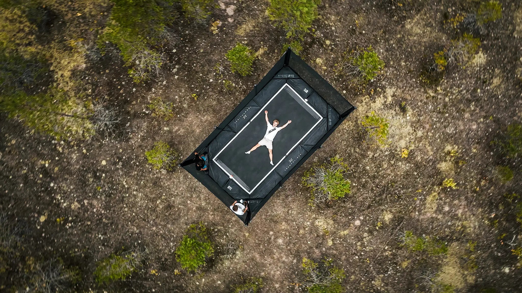 Aerial shot of a man lying on the Acon X trampoline.
