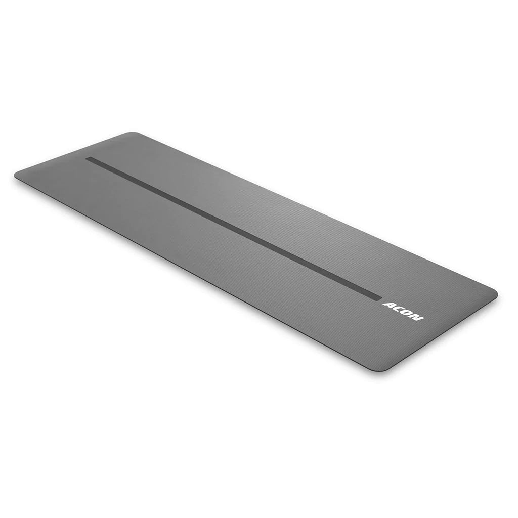 Black ACON yoga mat on a white background