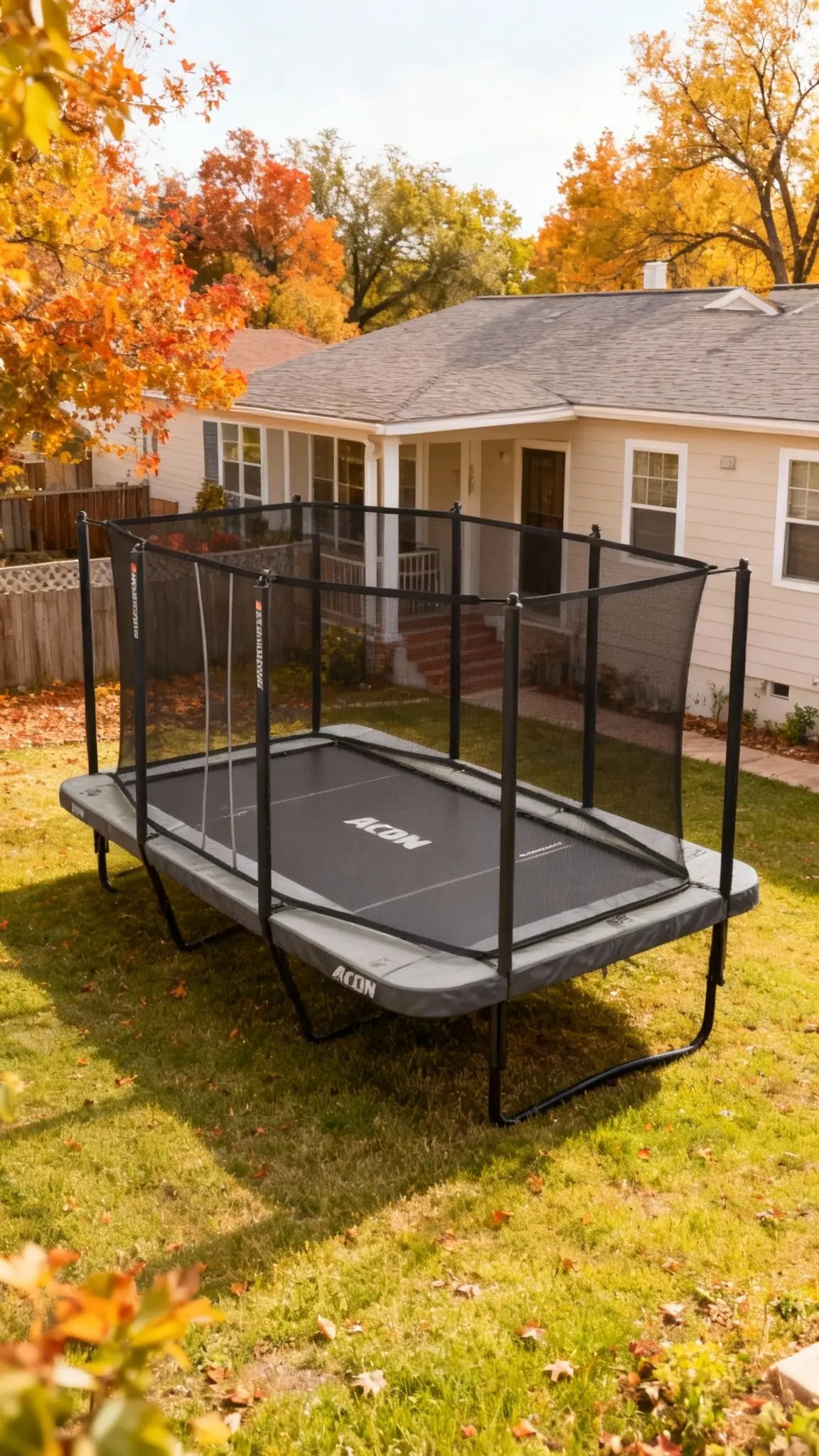 Acon HD 16 trampoline outdoors in a backyard in nice and cozy autumn weather. 