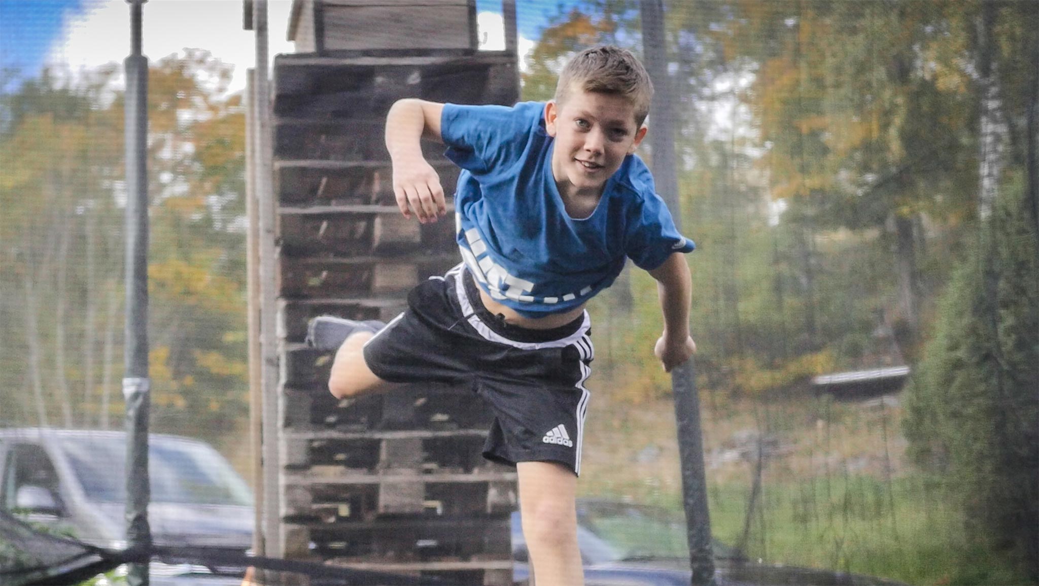 Garden trampoline jumper at autumn
