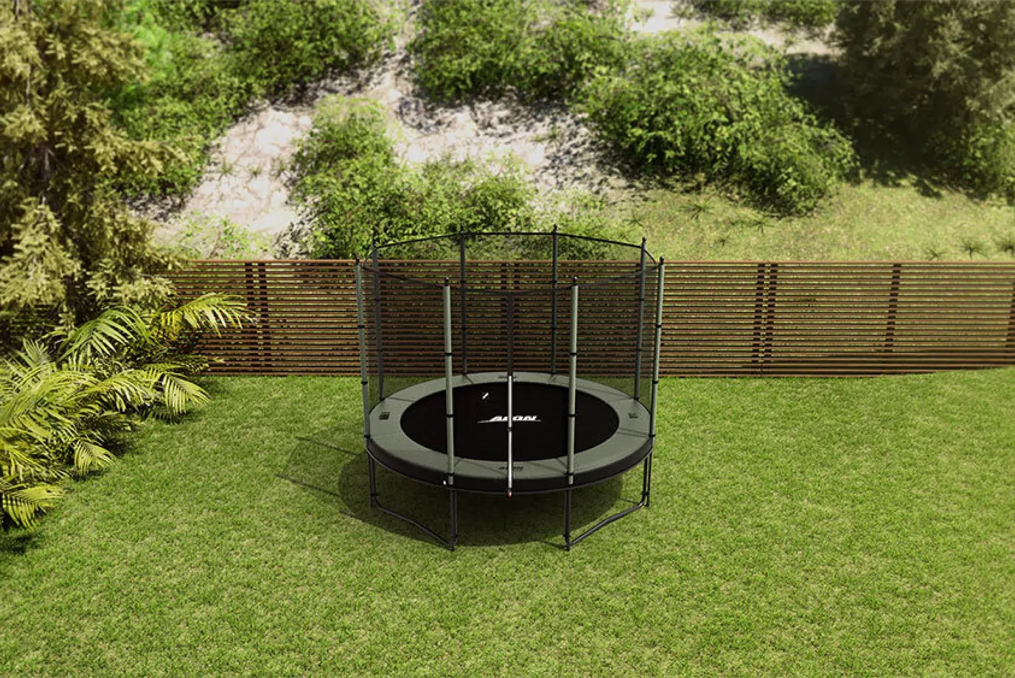 An Acon round trampoline with Acon safety net set up in a backyard with a wooden fence and greenery in the background.