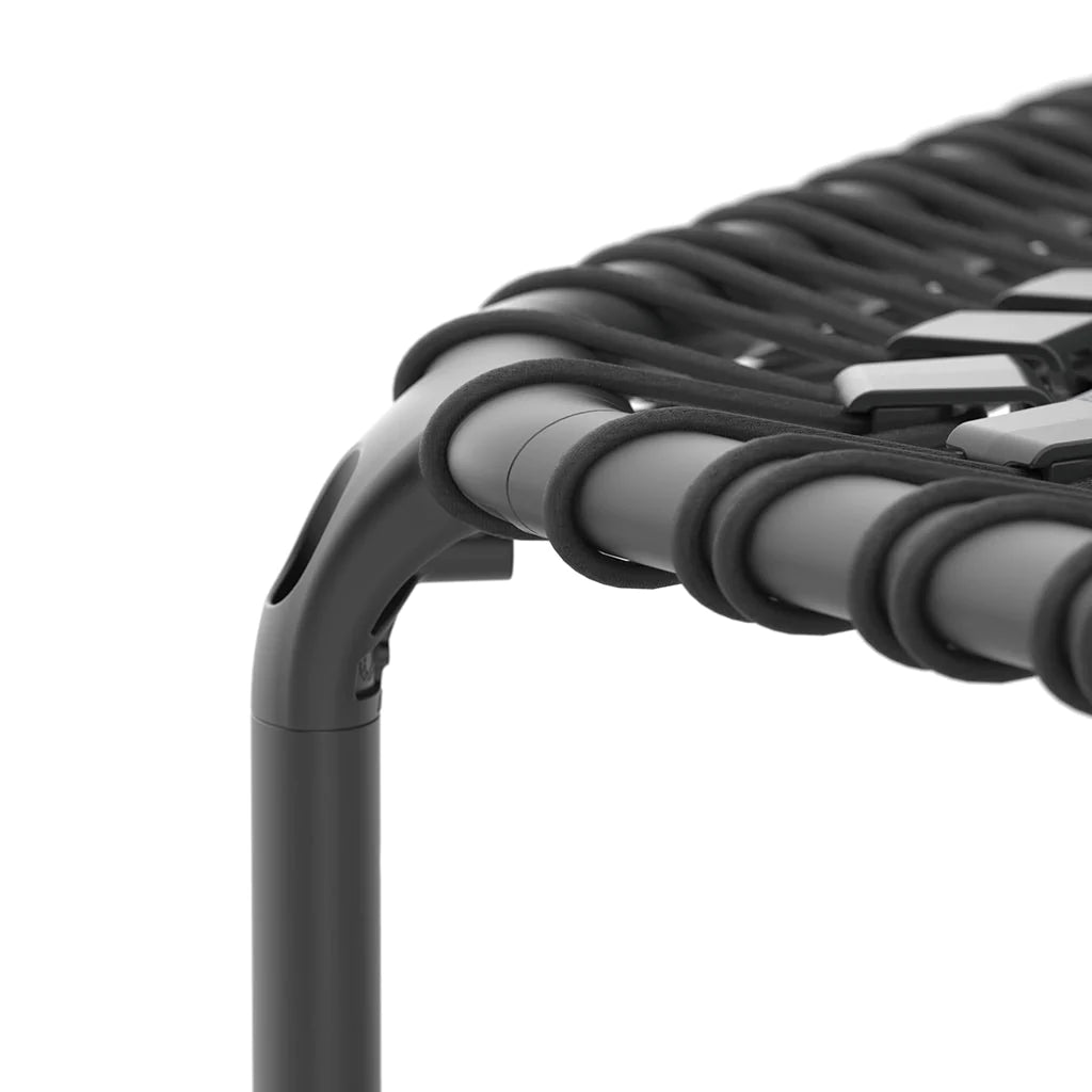 A closeup of the leg of ACON rebounder trampoline in black against a white background