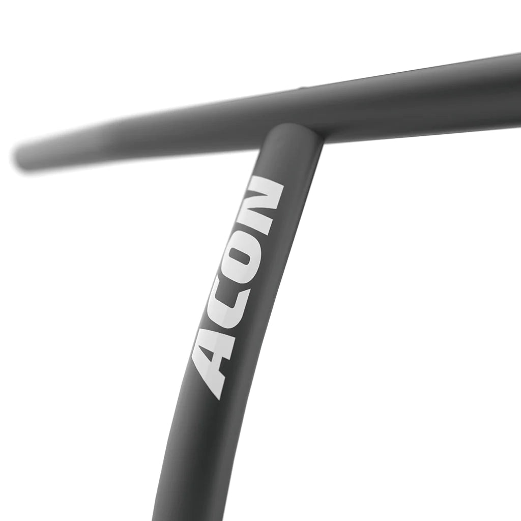 A closeup of a black acon rebounder handlebar against a white background