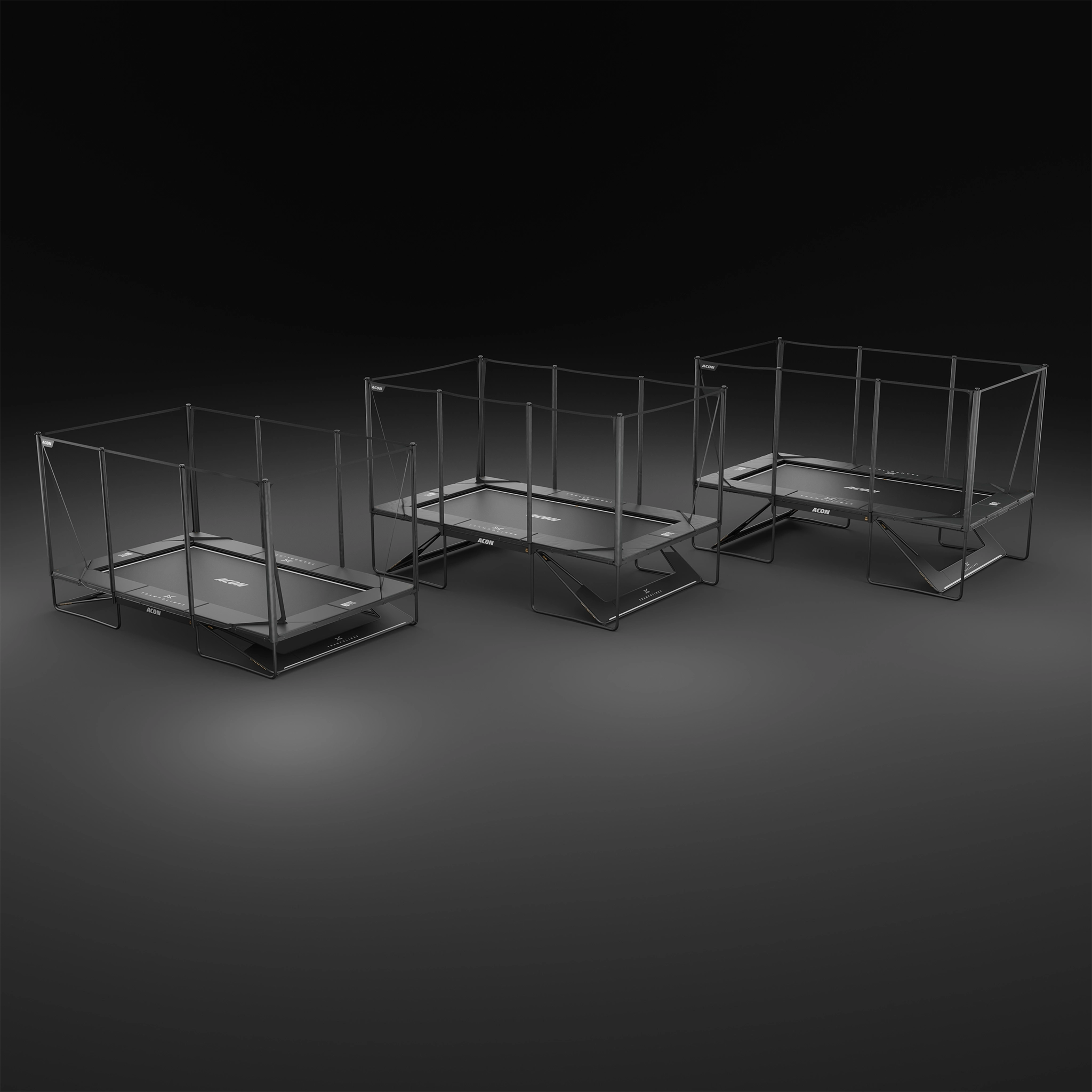 Three Acon X 17ft trampolines of different heights on a dark background.
