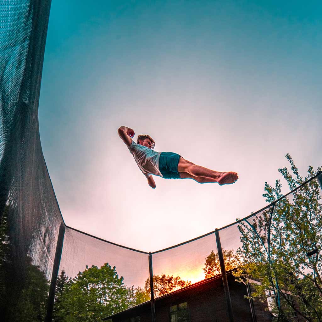 Boy tricker jumping on ACON trampoline.