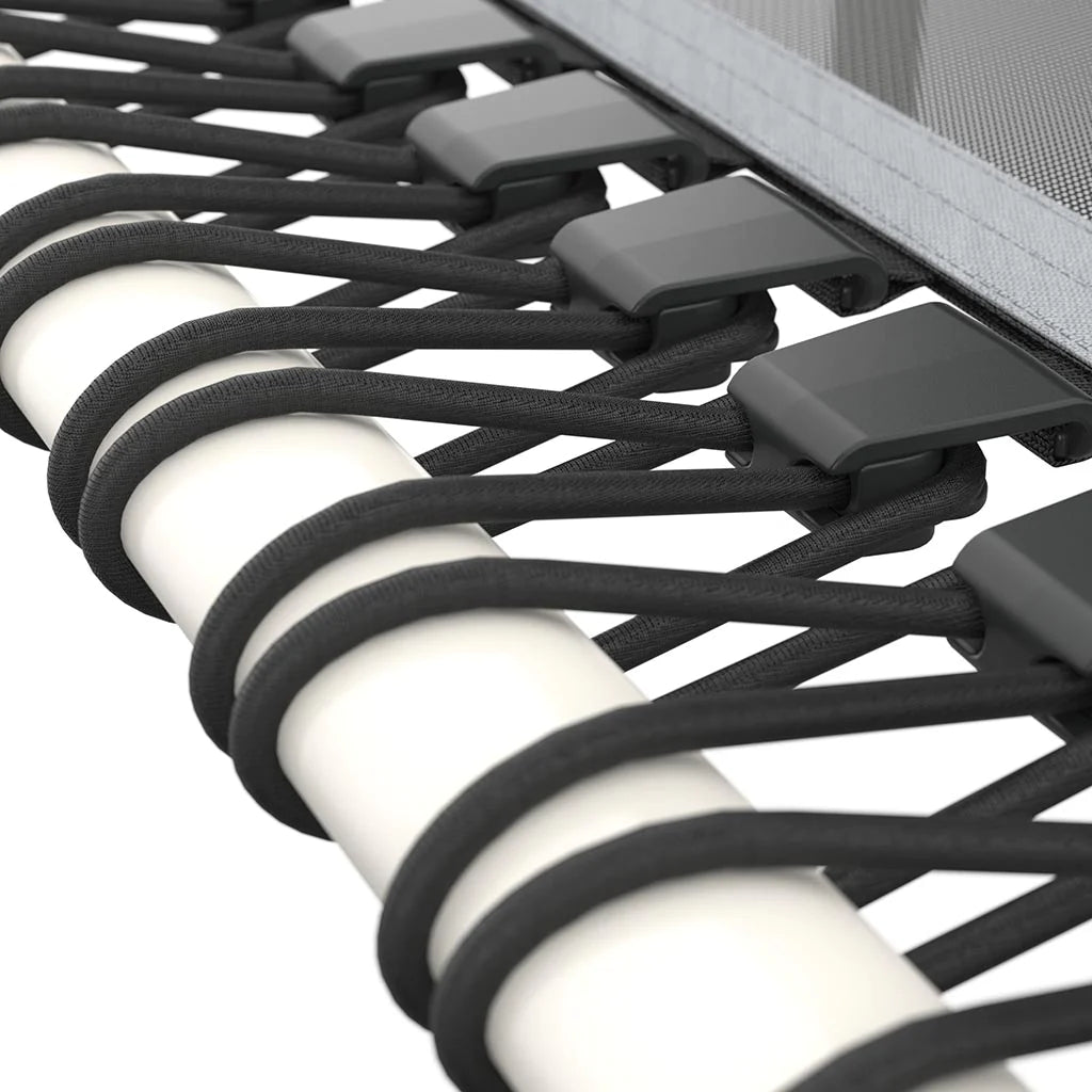 Closeup image of black bungee cords assembled on a white ACON rebounder