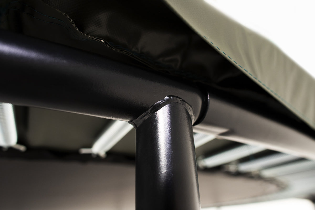 A close-up of the Acon trampoline frame welding and springs taken from the worm’s eye view 