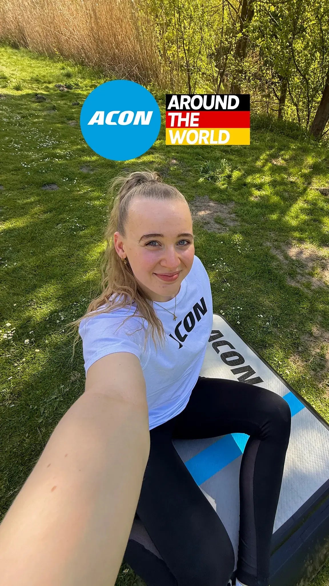 Gymnastics athlete Merle Loosen sitting on top of an Acon Airboard.