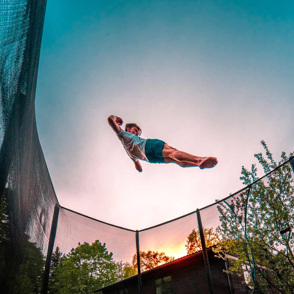 Boy tricker jumping on ACON trampoline